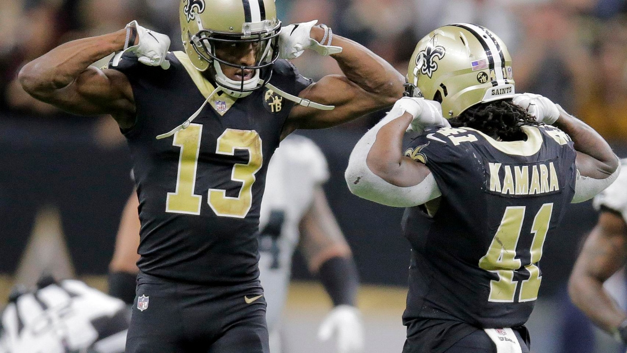 Michael Thomas y Alvin Kamara